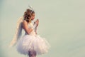 Angel child girl with curly blonde hair - Innocent girl concept. Teenager Cherub Cupid. Child with angelic character Royalty Free Stock Photo