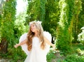 Angel children girl open arms in forest Royalty Free Stock Photo