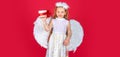 Angel children girl with white wings Cute baby child with angel wings. Angel kids with present gift, studio portrait Royalty Free Stock Photo