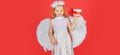 Angel children girl with white wings Cute baby child with angel wings. Angel kids with present gift, studio portrait Royalty Free Stock Photo