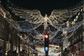 Angel Christmas lights and decorations on Regent Street in the evening, London, UK