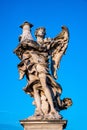 Angel with the Column statue on Ponte Sant`Angelo Saint Angel Bridge over Tiber river in historic center of Rome in Italy