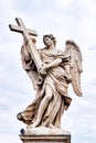 Angel with the Cross statue on Ponte Sant Angelo bridge in Rome Royalty Free Stock Photo