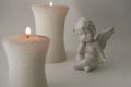 Angel figure with burning candles