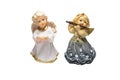 Angel figurines of a girl with a flute and a boy isolated on a white background Royalty Free Stock Photo