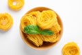 Angel hair pasta and basil leaves on white background, top view Royalty Free Stock Photo