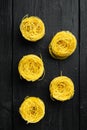 Angel hair pasta, on black wooden background, top view flat lay Royalty Free Stock Photo