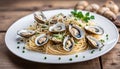 Angel Hair pasta with oysters and bean sprouts in a white enamel plate on a wooden surface.