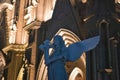 Angel holding a cross statue a church in the background at night Royalty Free Stock Photo