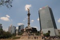 The Angel of Independence Monumento a la Independencia El Angel, with modern buildings in the background on a busy day, Mexico