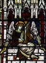 Angel making music in stained glass