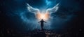 Angel, the messenger of God. Man spreading his arms under wings with a night sky background Royalty Free Stock Photo