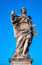 Angel with the Nails statue on Ponte Sant`Angelo Saint Angel Bridge over Tiber river in historic center of Rome in Italy Royalty Free Stock Photo