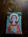Angel of a Piece. Handmade textile embroidery pendant in cross-stith technique