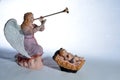 Angel playing Herald trumpet over baby Jesus Royalty Free Stock Photo