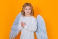 Angel prayer kids. Valentines day. Little cupid angel child with wings. Studio portrait of angelic kid. Royalty Free Stock Photo
