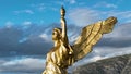 Angel on the roof of the house, Golden statue at sunset, Beautiful design