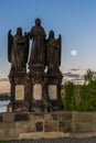 Angel sculpture at charles bridge in the early morning with full