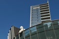 Angel sculpture at modern steel and glass skyscraper, financial center of Vilnius