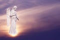 Angel sculpture over bright sky Royalty Free Stock Photo