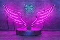 Angel shaped neon lamp with base for product display