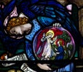 An angel showing the Annunciation in stained glass Royalty Free Stock Photo