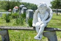 Angel Sitting on Stone Bench in Cemetery Royalty Free Stock Photo