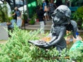 An angel statue amongst garden flowers Royalty Free Stock Photo