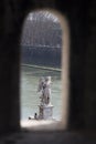 Angel statue of the bridge sant'Angelo from a loophole of the ca