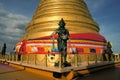 Angel statue with Golden stupa religious icon in Royalty Free Stock Photo