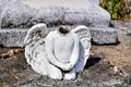 Angel statue without a head on a cemetery