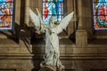 An angel statue inside of the Basilica of Sacre Coeur designed by Paul Abadie, 1914 - a Roman Catholic Church and minor basilica