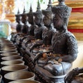 Angel statue and monk's alms bowl with put the coins