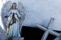 angel statue open arms and cross with copy space Royalty Free Stock Photo