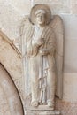 Angel, statue on the portal Cathedral of St Anastasia in Zadar, Croatia Royalty Free Stock Photo