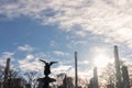 Angel on top of the Bethesda Fountain at Central Park in New York City with the Midtown Manhattan Skyline and a Shining Sun Royalty Free Stock Photo