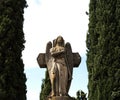 Angel of the trumpet in front of the cross Royalty Free Stock Photo