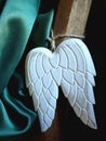 Angel wing ornament with a silky curtain hanging on a chair-back Royalty Free Stock Photo