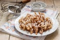 Angel wings biscuits, a traditional European sweet dish for carnival. Rustic style. Royalty Free Stock Photo