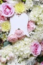 Angel wings among flowers. Romantic flower ornament Royalty Free Stock Photo