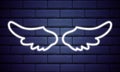Angel wings neon sign. Bright light banner. Glowing neon white wings icon on dark brick wall background. Vector illustration Royalty Free Stock Photo