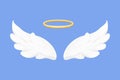 Angel wings white with halo, nimbus in cartoon style isolated on blue background, design element for decoration. Royalty Free Stock Photo