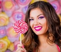 Angelica, face lollipop pink background green contact lenses Royalty Free Stock Photo