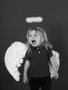 Angels also cry. little angel boy crying with white feather wings and halo Royalty Free Stock Photo