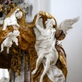 Angels - detail of pulpit in baroque Church, richly decorated pulpit in Basilica St. Martin, Weingarten, Germany