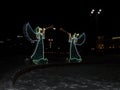 Angels and a magical Christmas night. New year illumination. The concept of New year and Christmas.