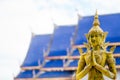 Angels statue to pay respect in blue roof and white sky background. Royalty Free Stock Photo