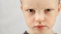 Anger child, emotion contempt, not love others, difficult childhood. Portrait caucasian boy 4 years old, angry child Royalty Free Stock Photo