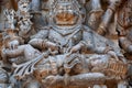 Anger Lord Narasimha killing the enemy, form of the Hindu god Vishnu, on stone carved temple. Halebidu heritage, India