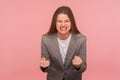 Anger management problems. Portrait of furious irritated woman in business suit expressing hate with clenched teeth